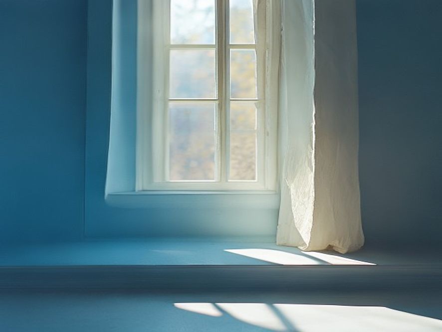 Bright morning light streaming through windows of a calm space